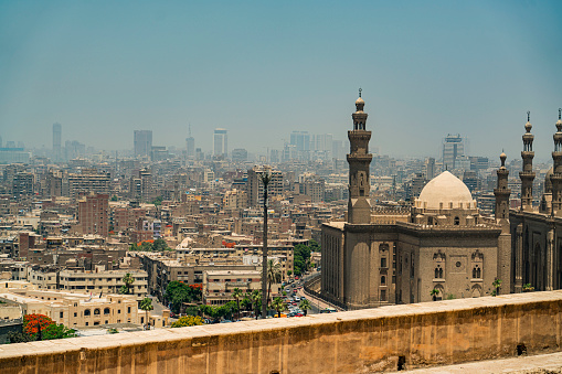 High angle of the city in shades of brown, from the Citadel Saladin to downtown. Aqsunqur Mosque in the frame.