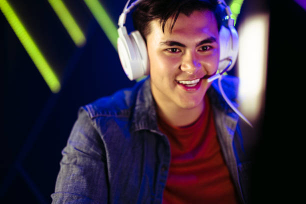 istock Happy male gamer looking at his computer screen during an online video game 1483848511