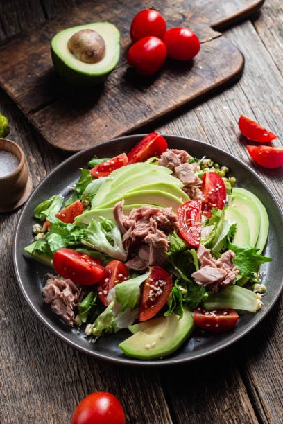 istock Salad with tuna, avocado and tomatoes in a bowl 1483848666