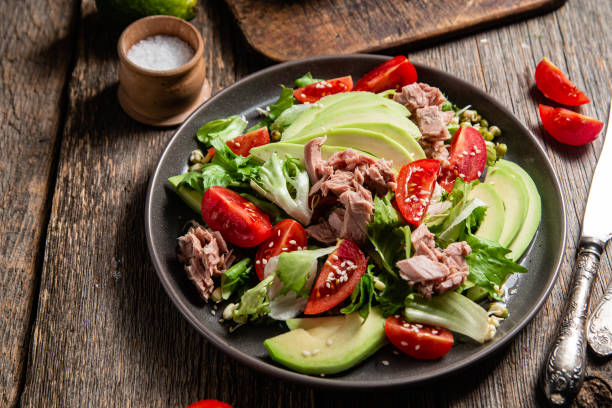 istock Salad with tuna, avocado and tomatoes in a bowl 1483848968
