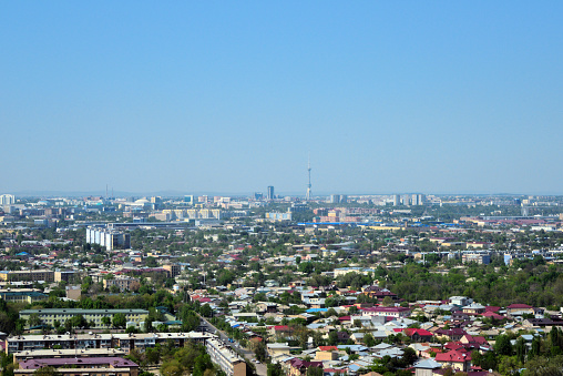 Tashkent, Uzbekistan: cityscape of the sprawling Uzbek capital with the Tashkent television tower ('Toshkent Teleminorasi') in the center. The city, which has a population of more than two million, is located north of the Great Silk Road on the border with Kazakhstan on the western edge of the Tian Shan.
