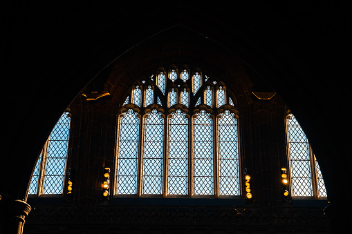 Holy light in the church window . Sun rays inside the place of worship