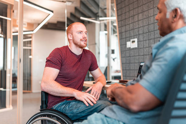 istock Two men sitting in the office and talking 1483855627