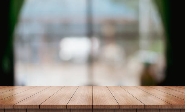 istock Empty wooden table top with lights bokeh on blur restaurant background. 1483860759