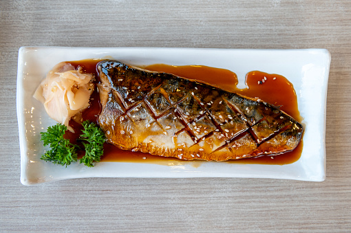 Saba grilled mackerel, Japanese food on a white plate.