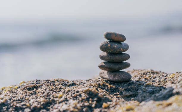 istock Rock stone stack balance on sea beach backgrounds 1483862428