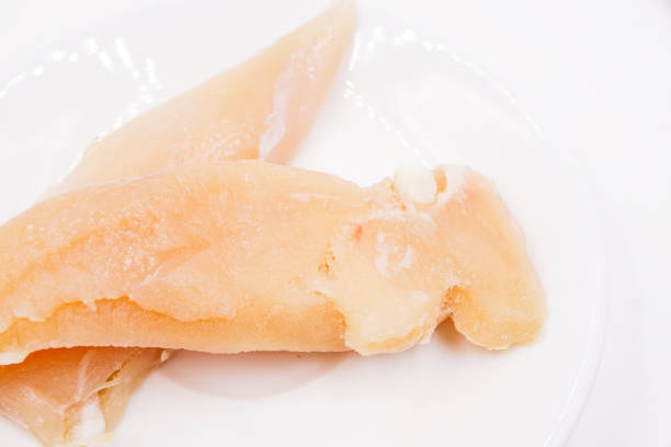 istock Frozen raw chicken breast fillet 1483862659