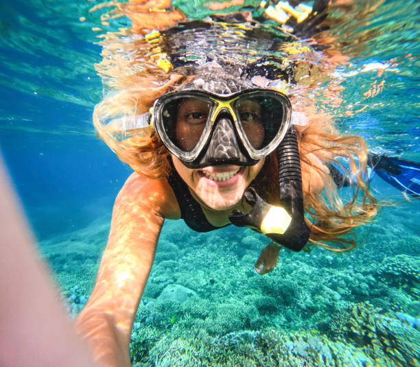 istock Underwater Woman Snorkeling in Ocean 1483863386