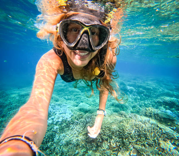istock Underwater Woman Snorkeling in Ocean 1483863584
