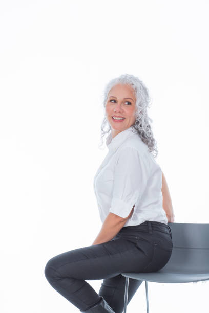 istock mature latin woman looking at the camera that portrays her executively dressed 1483864477