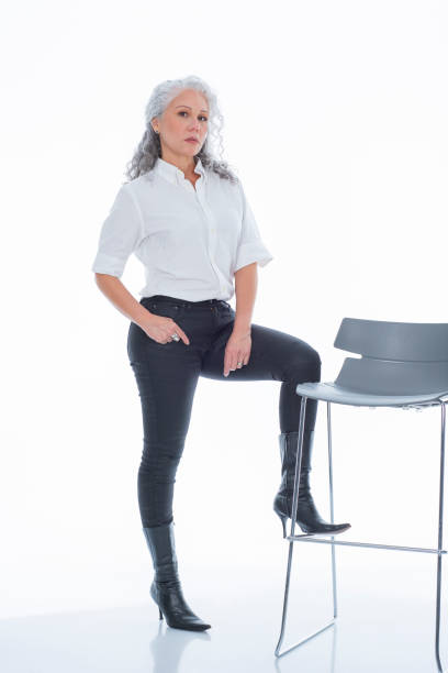 istock mature latin woman looking at the camera that portrays her executively dressed 1483864544