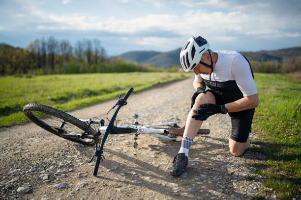 istock Senior man on the ground after falling with the bike. 1483865663