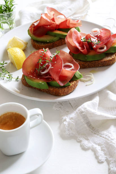 istock Avocado toast with bresaola (smoked meat). 1483867236