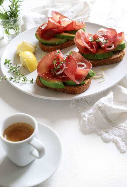 istock Avocado toast with bresaola (smoked meat). 1483867337