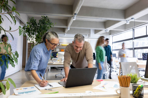 istock Senior business executives working together at the office 1483869310