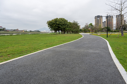 The path of the park next to the urban residential area
