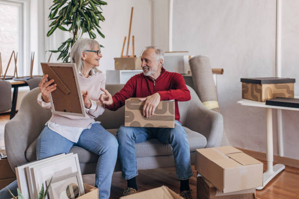 istock Senior couple unpacking in new home 1483876183