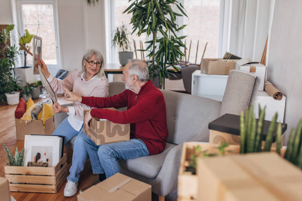 istock Senior couple unpacking in new apartment 1483876717