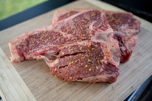 Beef Porterhouse steak is a generous cut that includes both the New York strip and tender filet mignon, making it a flavorful and indulgent dining experience