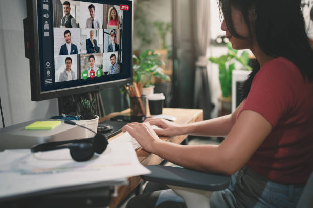 istock Smiling asian woman using computer for work at home, vdo conference and online work with colleague, Freelance work anywhere and digital nomad concept. 1483877323