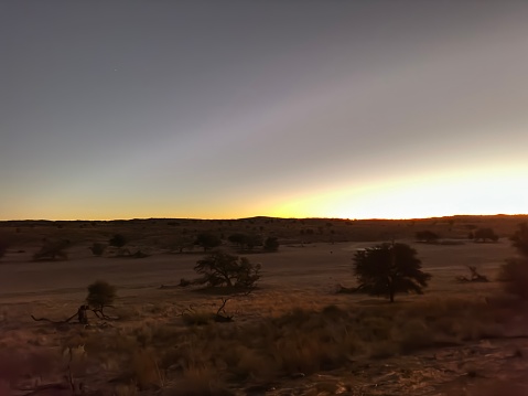 Dawn over desert landscape