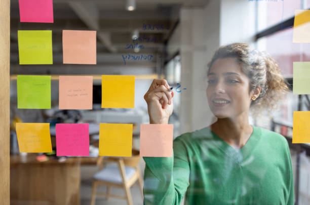 istock Business woman brainstorming while working at the office 1483885286