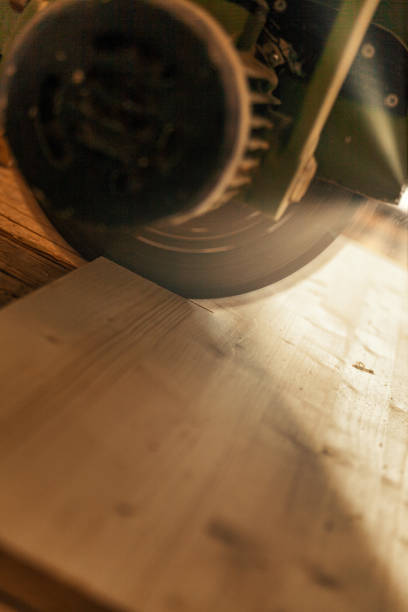 istock Sunbeams and dramatic atmosphere on circular saw cutting. 1483890664