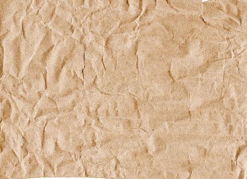 Crumpled paper with tears and dusty texture
