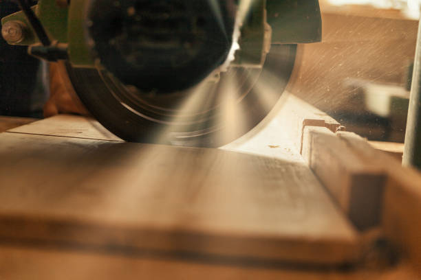 istock Sunbeams and dramatic atmosphere on circular saw cutting. 1483892082