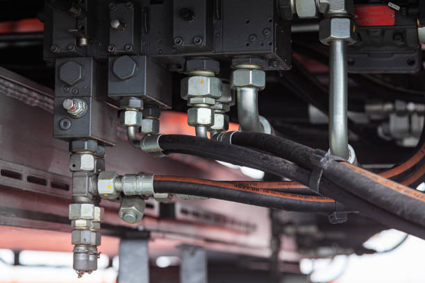 istock High pressure hydraulic hose system connected with steel pipes and connected to the system, close-up. Hydraulics of a large truck crane. 1483899191