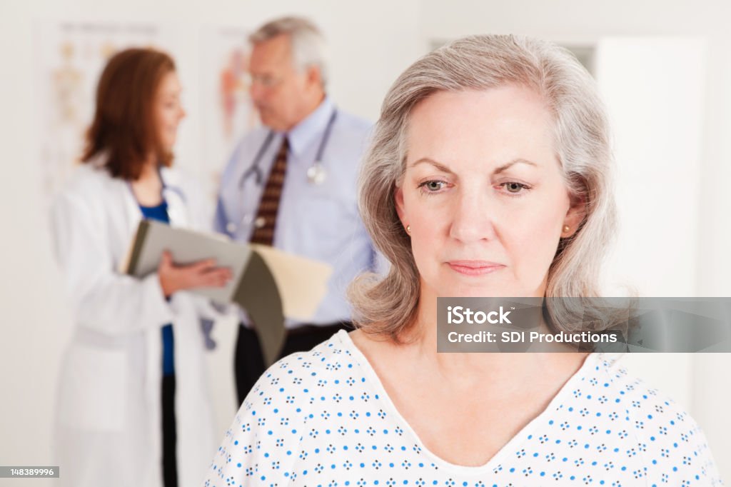 Ein deprimierter Patient im Doctor's Office - Lizenzfrei Heilbehandlung Stock-Foto