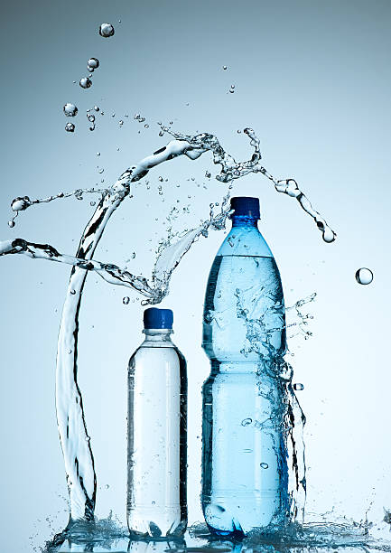 istock Bottles with mineral water and splash around it 148390218