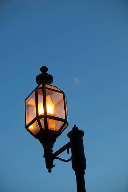 istock A traditional, colonial streetlamp illiminated in evening 148390294