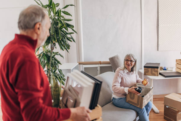 istock Senior couple unpacking in new home 1483905683