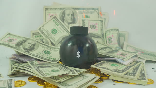 Bomb with Tax sign on money background