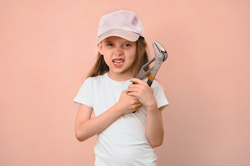 When dad wanted a son, but he is raising a daughter. Girl tomboy with a wrench.