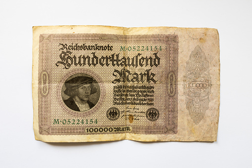 Hunderttausend Mark (one hundred thousand Mark) banknote of the German Reichsbank from 1923. Old money during the hyperinflation in Germany. Historical devaluation of cash due to recession.