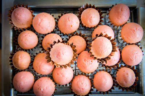 Strawberry cupcakes on a cooling rack