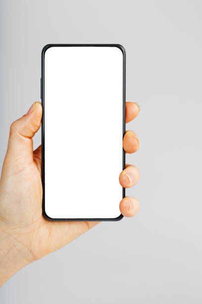 istock Smartphone with a clean white screen in your hand close-up. 1483920599