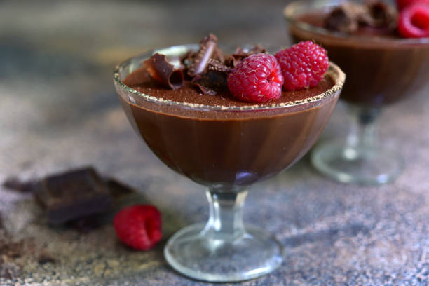 istock Delicious chocolate mousse with raspberr on a dark slate, stone or concrete background. 1483921199