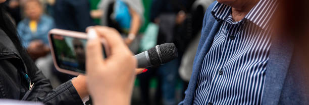 istock Reporters making media interview 1483925211