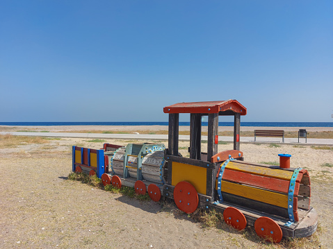 Wooden train of nice colors in children's playground