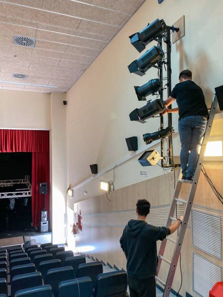 istock Sound technicians working on the installation of lights and spotlights 1483930134