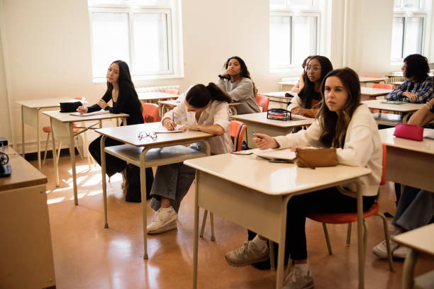 istock College students listening in classroom. 1483934141