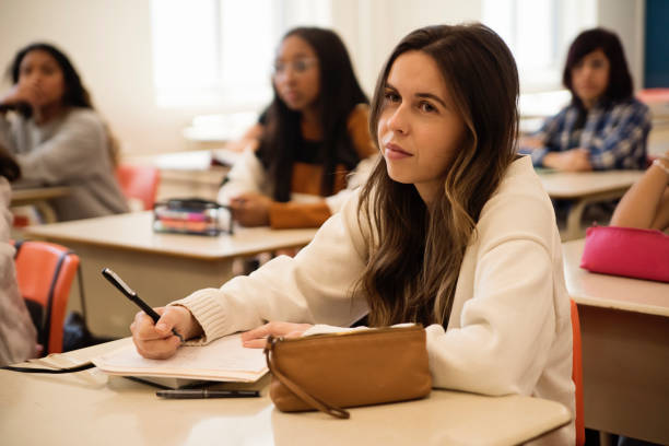istock College students listening in classroom. 1483934194
