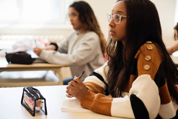 istock College students listening in classroom. 1483934324