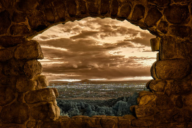 Window to the World of Albuquerque This photo of Albuquerque, New Mexico, was taken from inside one of the rock houses on the Sandia Mountains. mckenney stock pictures, royalty-free photos & images