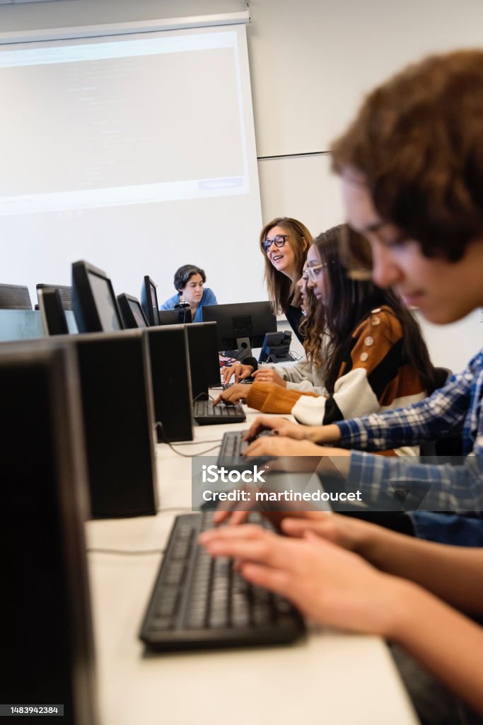 Student Coding Picture College Students Coding With Teacher In Tech Lab Classroom Stock Photo ...