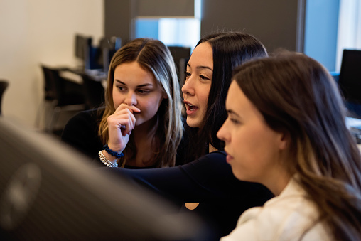 College Students Coding In Team In Tech Lab Classroom Stock Photo ...