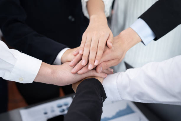 istock Top view closeup business team join hand stack together for harmony concept. 1483946198